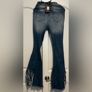 Brand New blue jeans with holes. They are long, run small, and do not stretch.